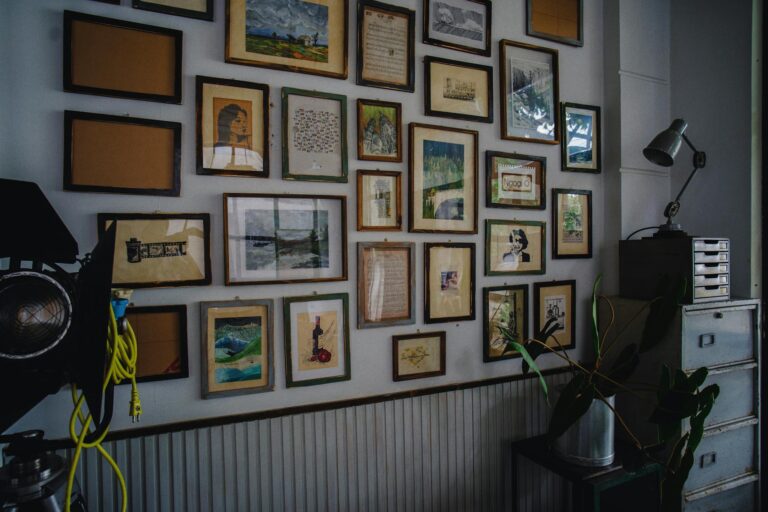 A cozy room with a collection of framed artwork and a modern industrial style.